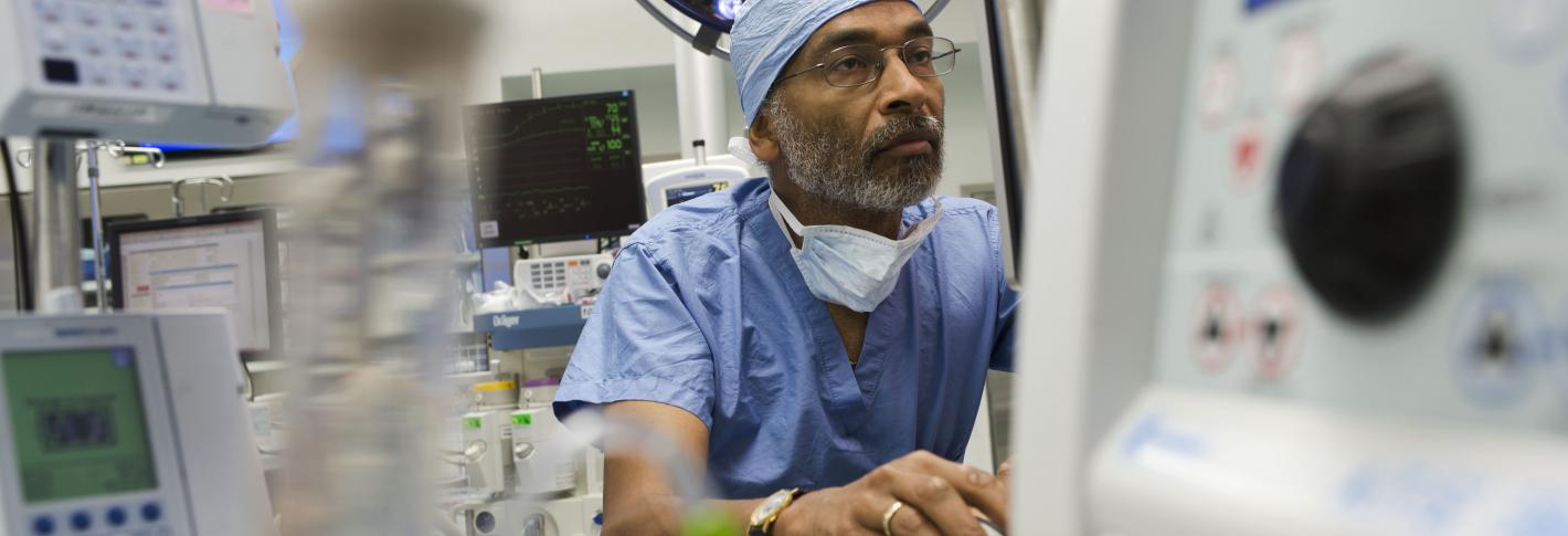 Emery Brown in an operating room setting wearing scrubs 