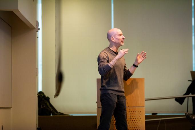 Earl Miller addresses a symposium audience